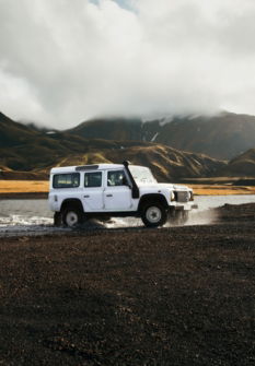 white car crossing body of water